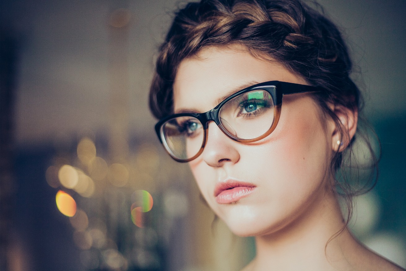 Girl Poses Wearing Eye Glasses