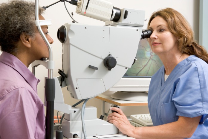 Doctor Inspecting Eye Of A Patient