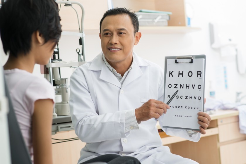 Doctor Inspecting Eye Of A Patient