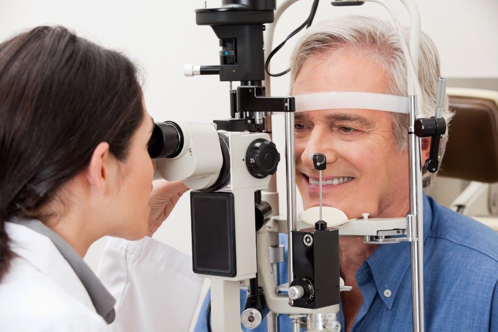 Doctor Inspecting Eye Of A Patient