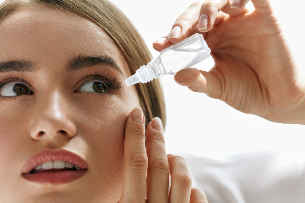 Girl Puts Eye Drop In The Eye